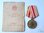 Medalha pela vitória contra a Japão com documento de concessão